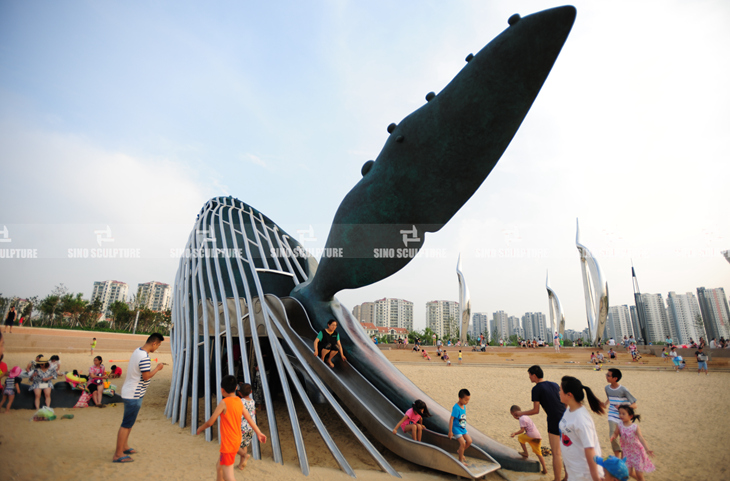 bronze whale statue with S/S slides