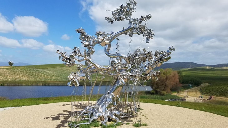 mirror stainless steel people tree installed in Sonoma, designed by artist Subodh Gupta