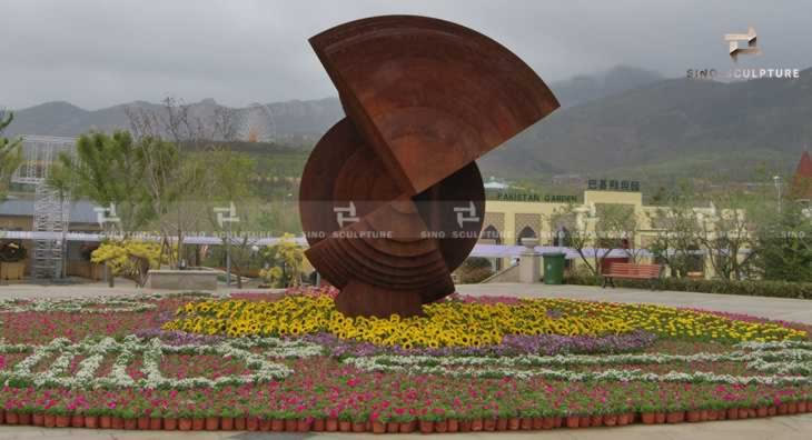 large outdoor corten steel art installation sculpture