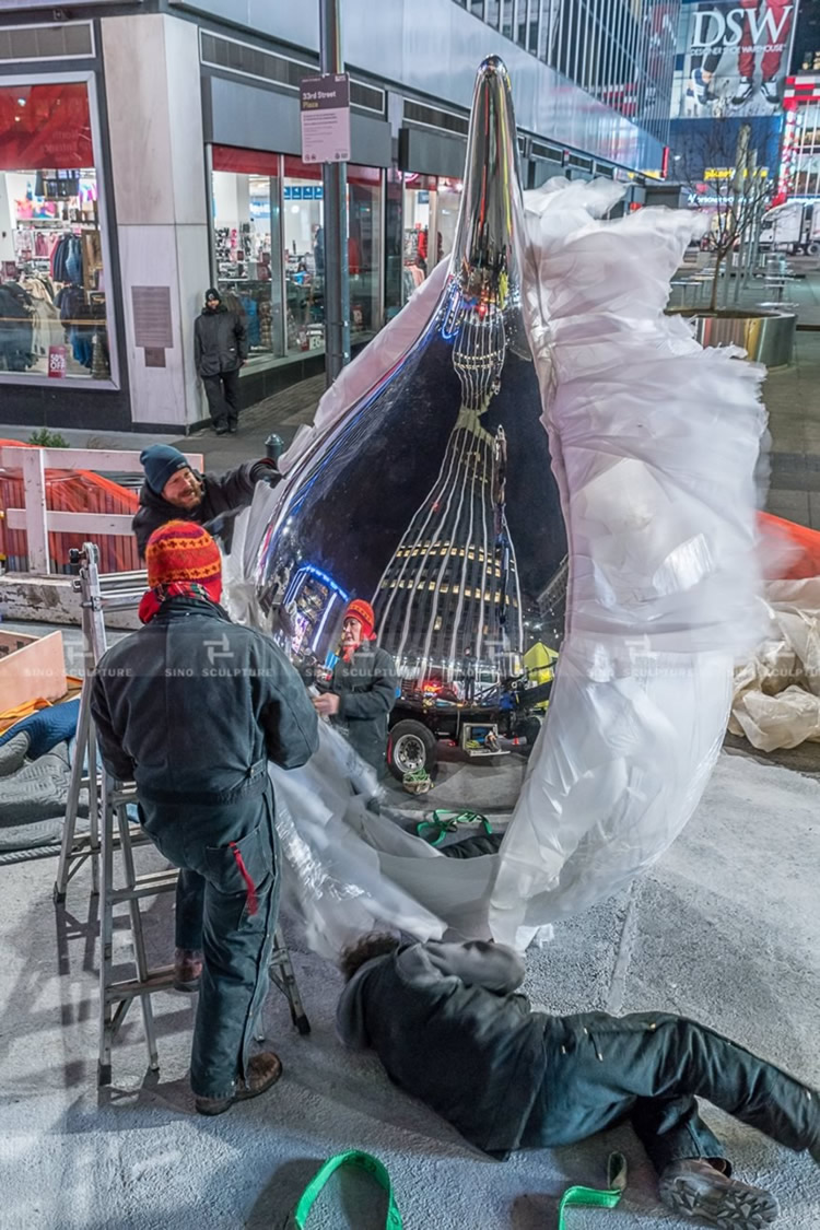 installation of the mirror stainless steel sculpture at time square NYC