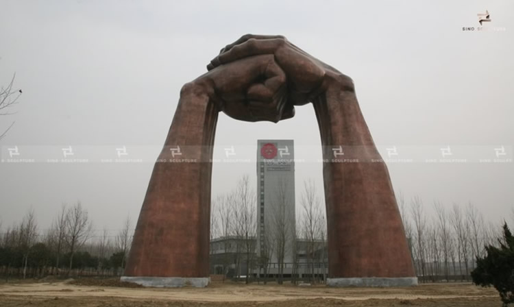 the completion of the large scale bronze forged hand shape sculpture