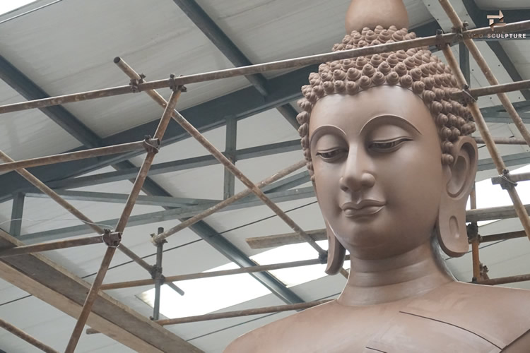 clay model of the buddha face