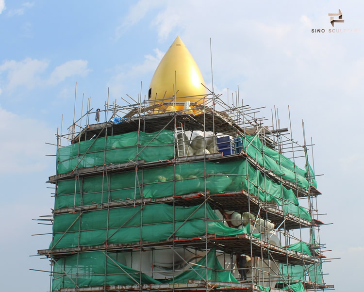 installation of large buddha statue