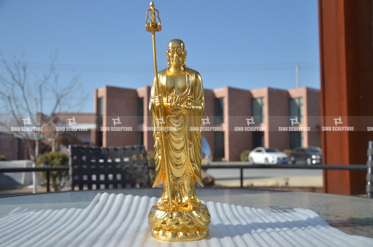 A gold leaf bronze Buddha statuary.