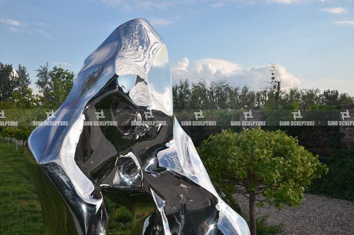 custom stainless steel rock sculpture with mirrored surface