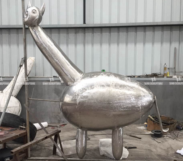 hand forging process of painted stainless steel sculpture