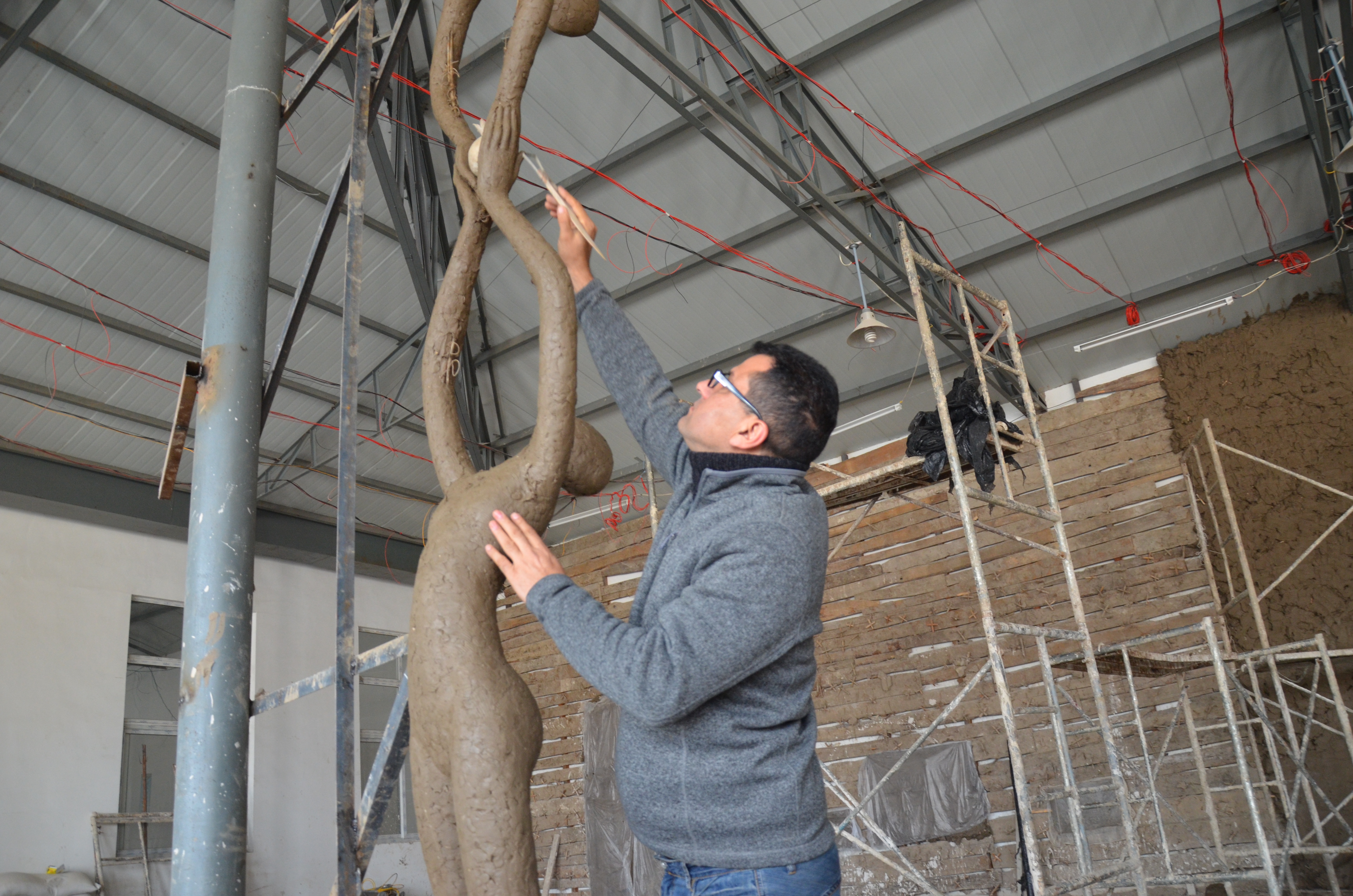 Ayad is optimizing the clay model of the custom bronze sculpture in sino�s foundry