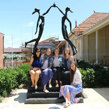 campus girls hptoed with the custom bronze sculpture