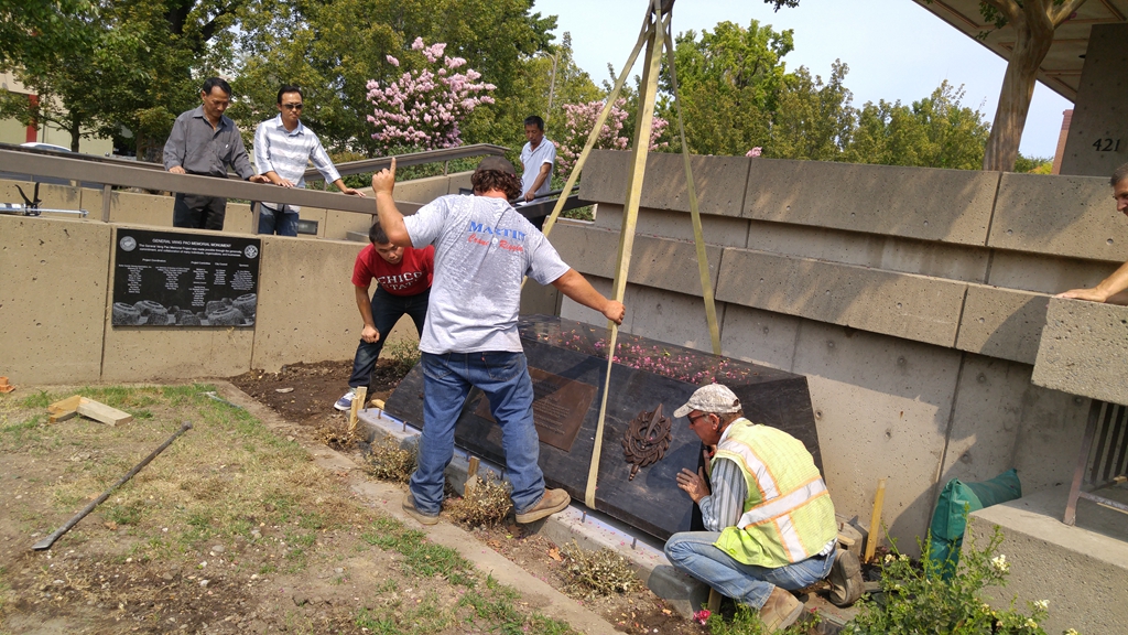 stone pedestal installation of the cast bronze statue