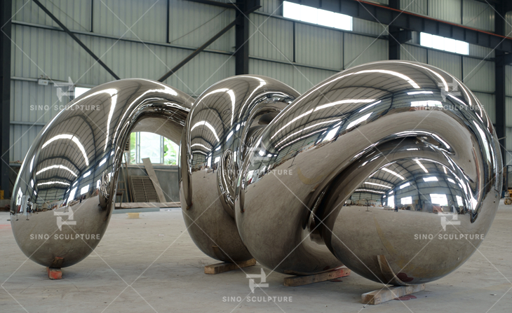 China mirror stainless steel monumental sculpture company