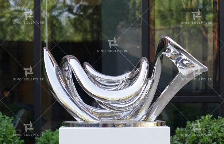 curved stainless steel abstract statue for sale