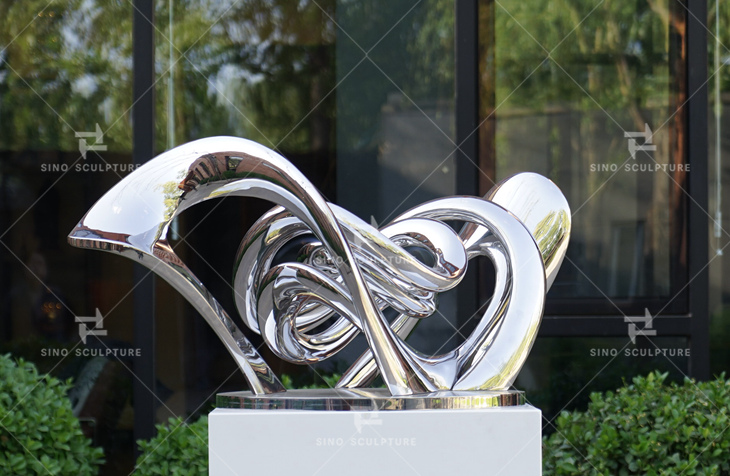 custom curved stainless steel abstract statue