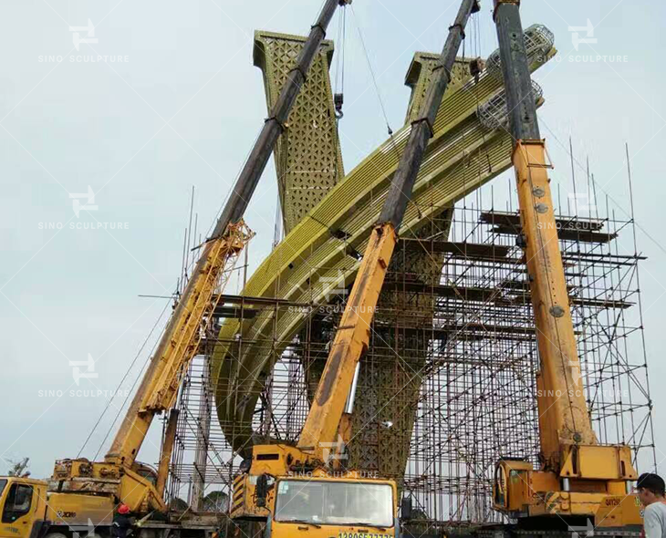 Site installation of the large V monument at site.