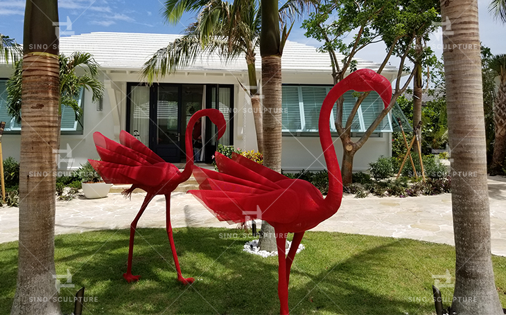 After site installation of the 5 red steel mesh Flamingo sculpture in Miami, USA