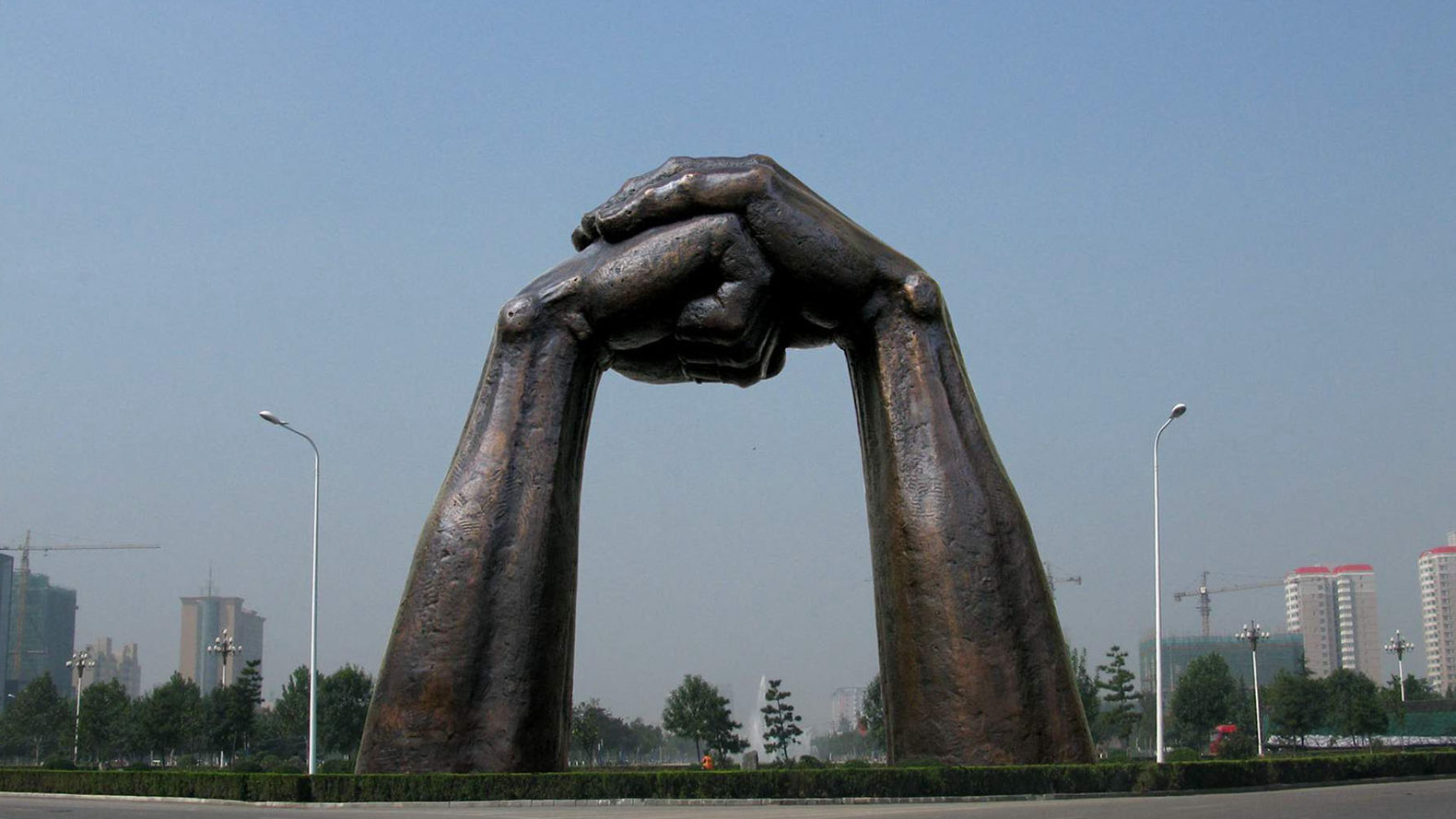 large bronze hand sculpture, large bronze door sculpture 