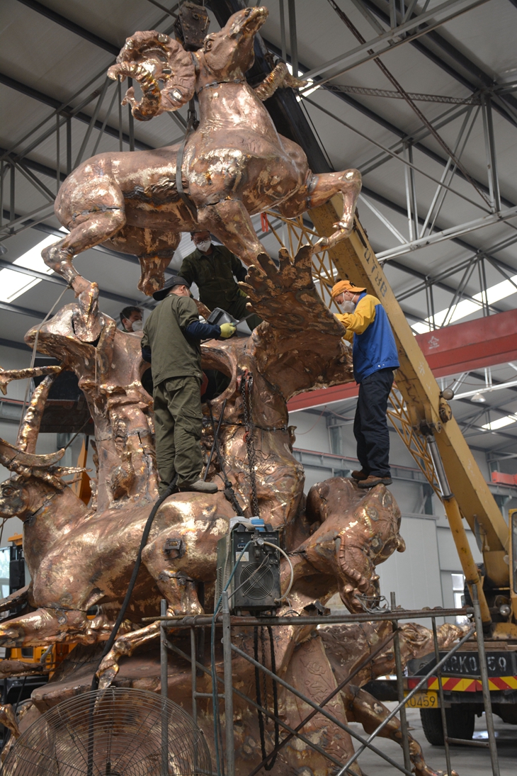 Welding the Cast bronze panel to form a large bronze Monument