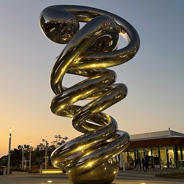 Night View of the Mirror Polished Steel JUNK DNA Sculpture